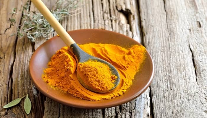 turmeric powder on spoon